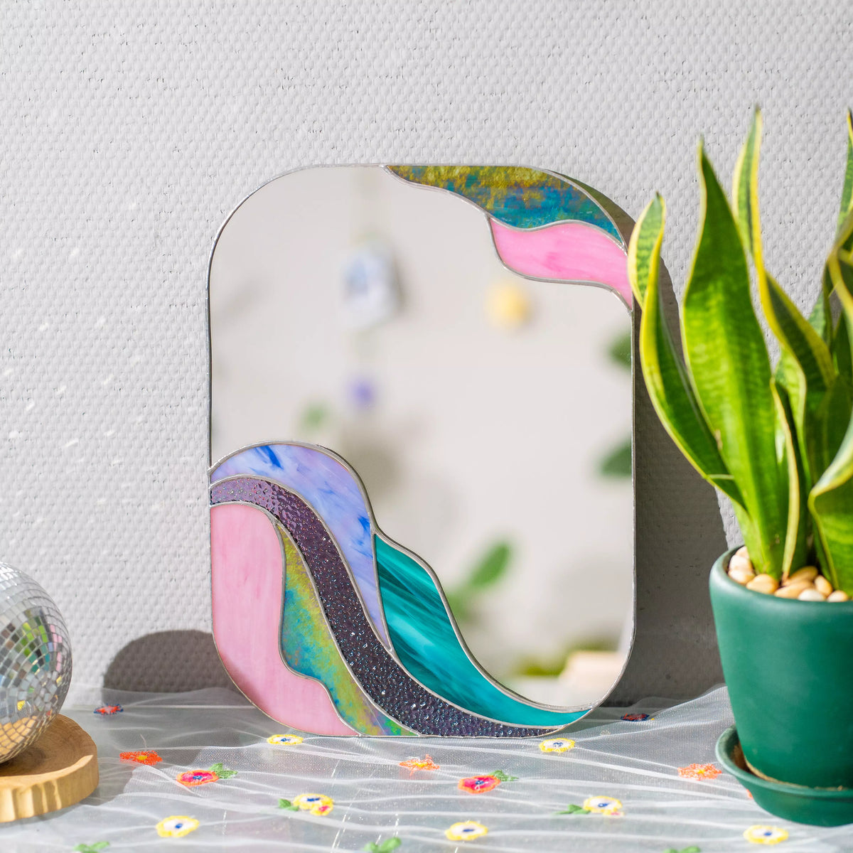 Handmade stained glass mirror with fluid purple wave border, Tiffany copper foil technique — elegant boho wall art and a thoughtful gift for lovers of unique home decor
