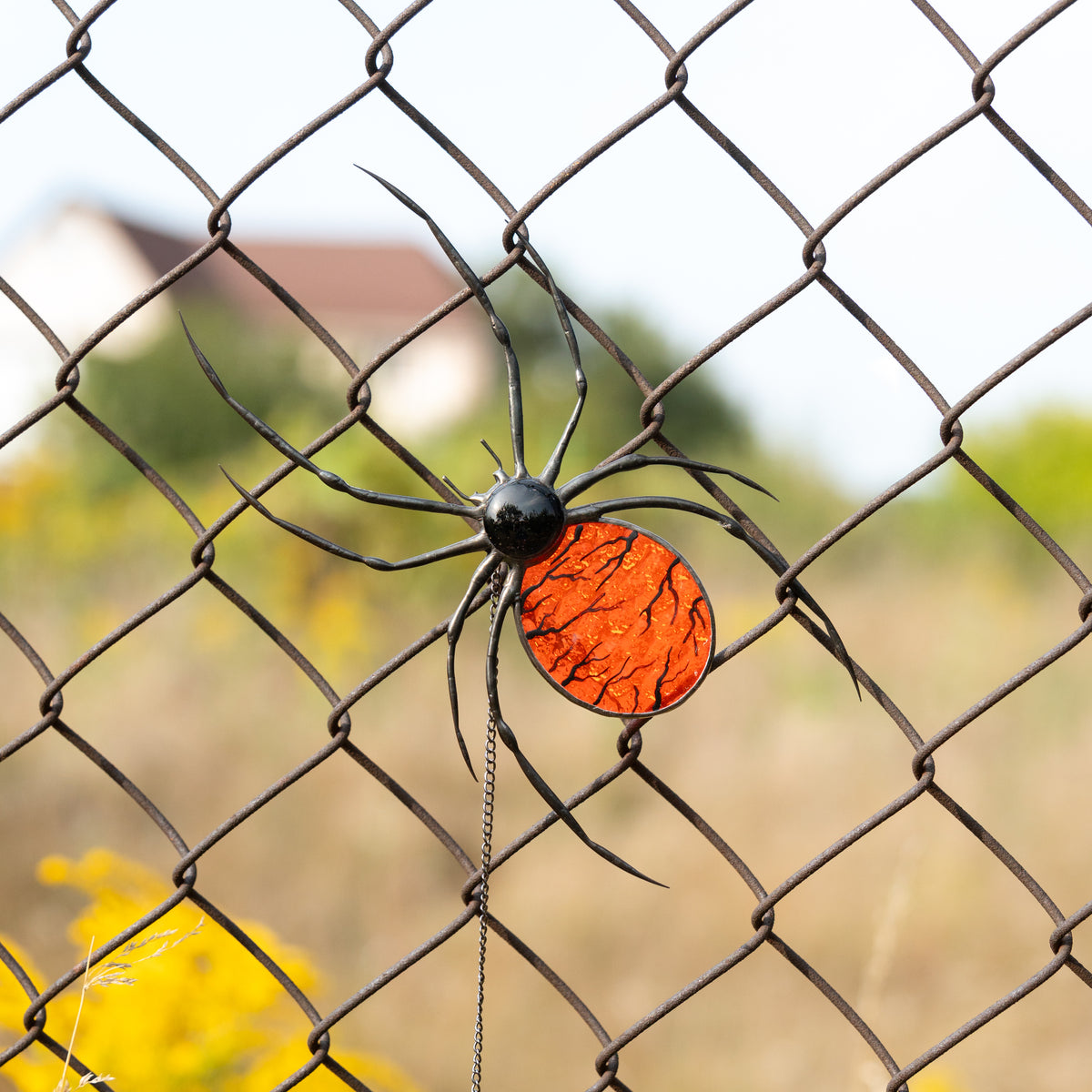 orange spider stained glass suncatcher