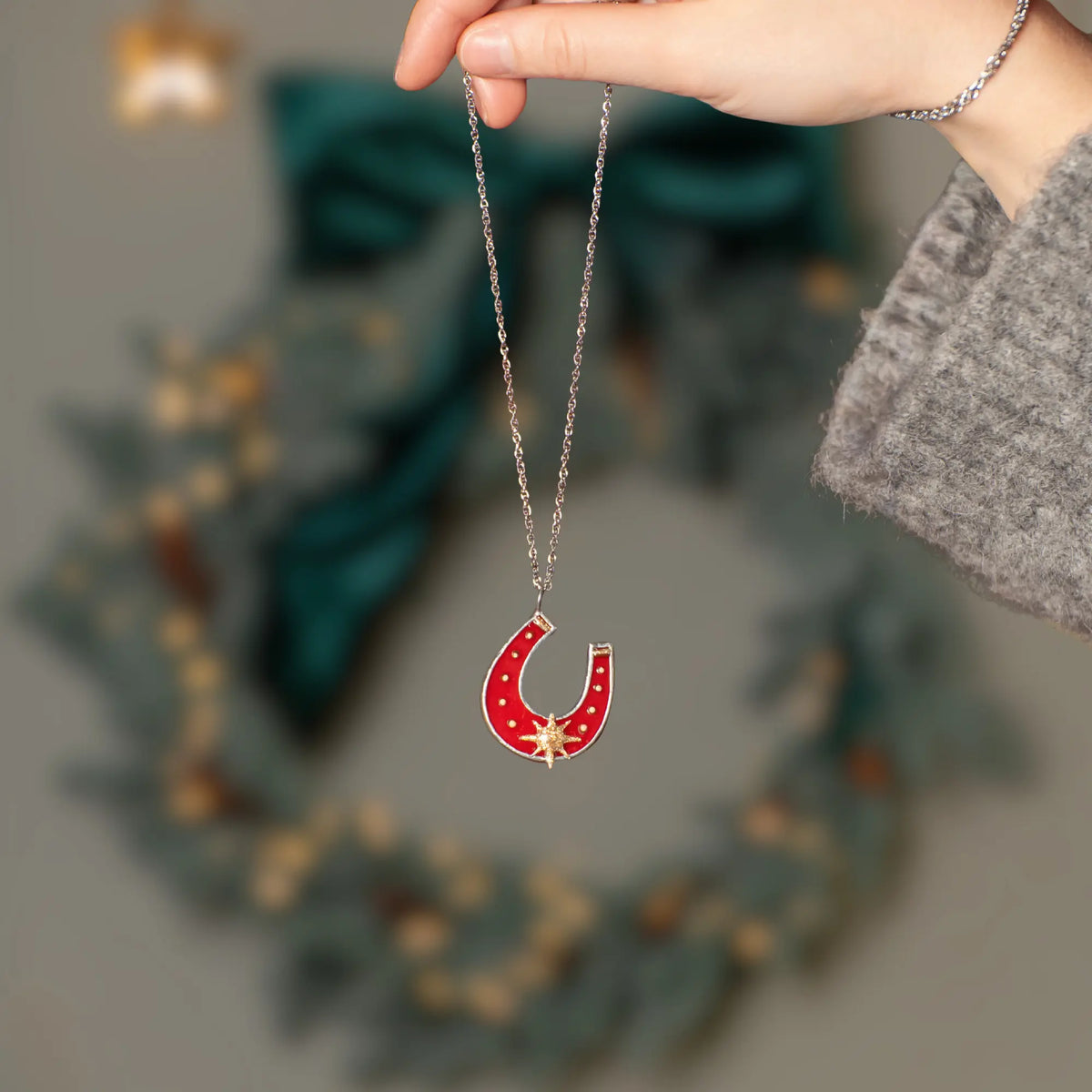 Stained glass horseshoe pendant on a silver necklace
