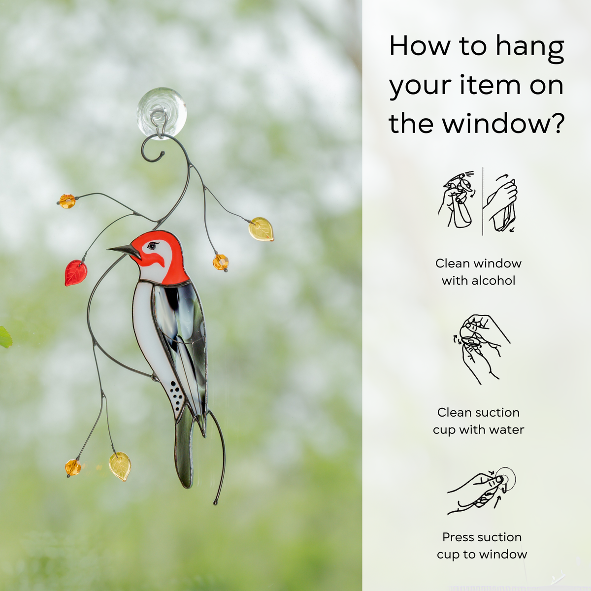 Woodpecker suncatcher attached to window via suction cup, side panel shows hanging instructions step-by-step.