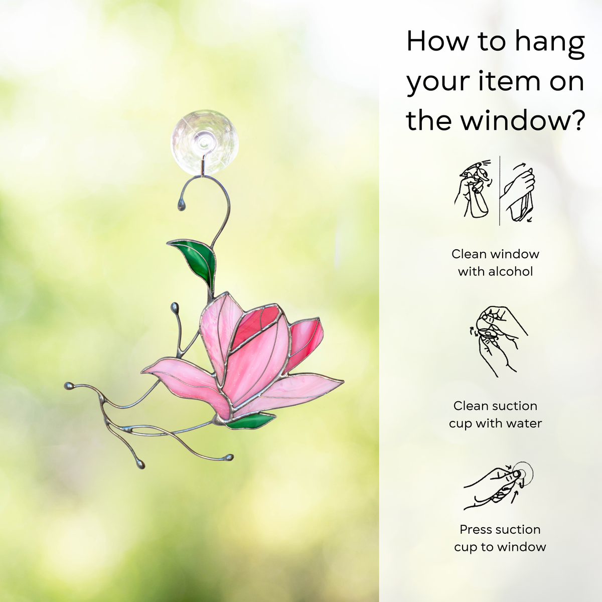Magnolia flower suncatcher hanging on a window with illustrated instructions for suction cup attachment: clean window and suction cup, press a cup to the surface