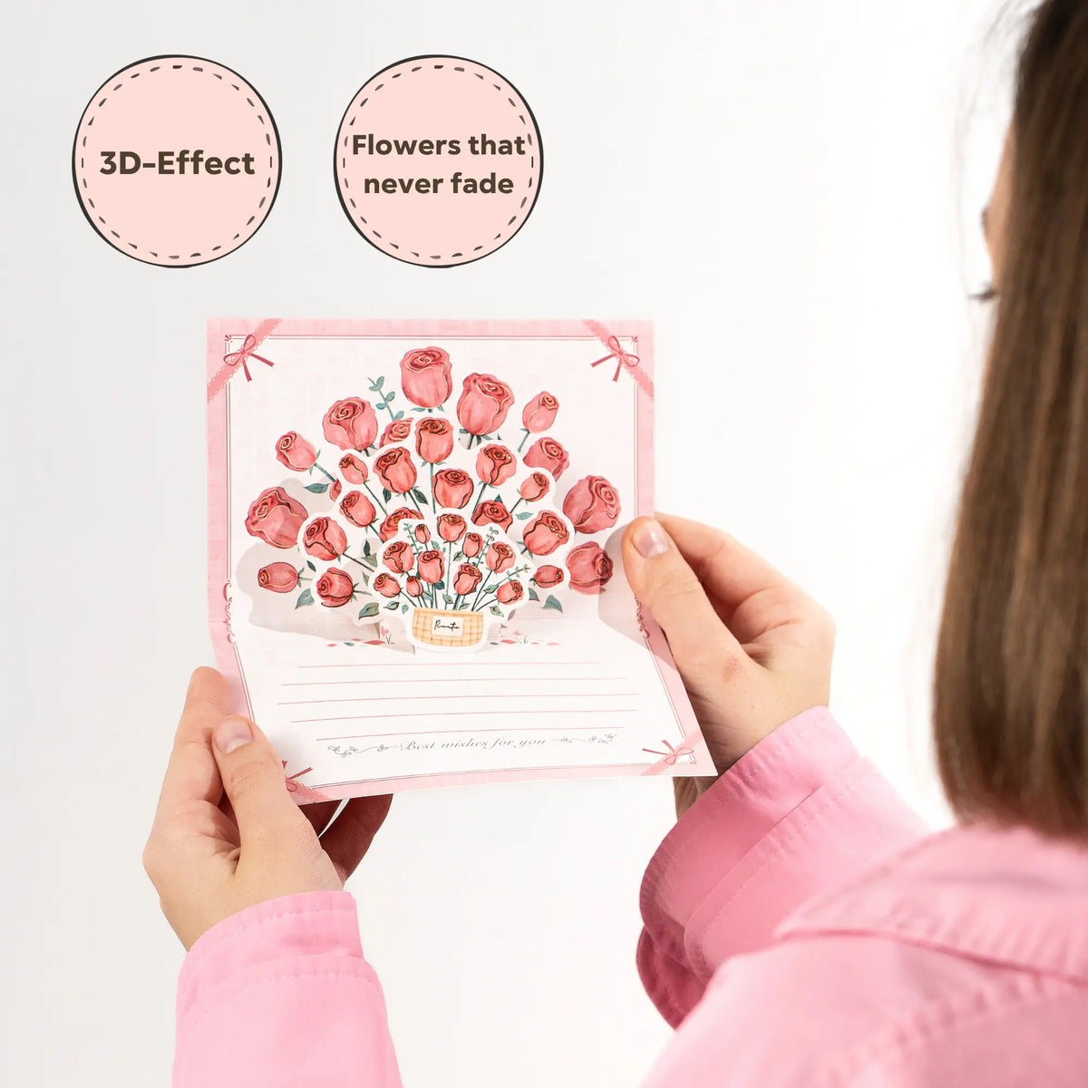 Women holding a floral card with 3D effect and 'Flowers that never fade' text.