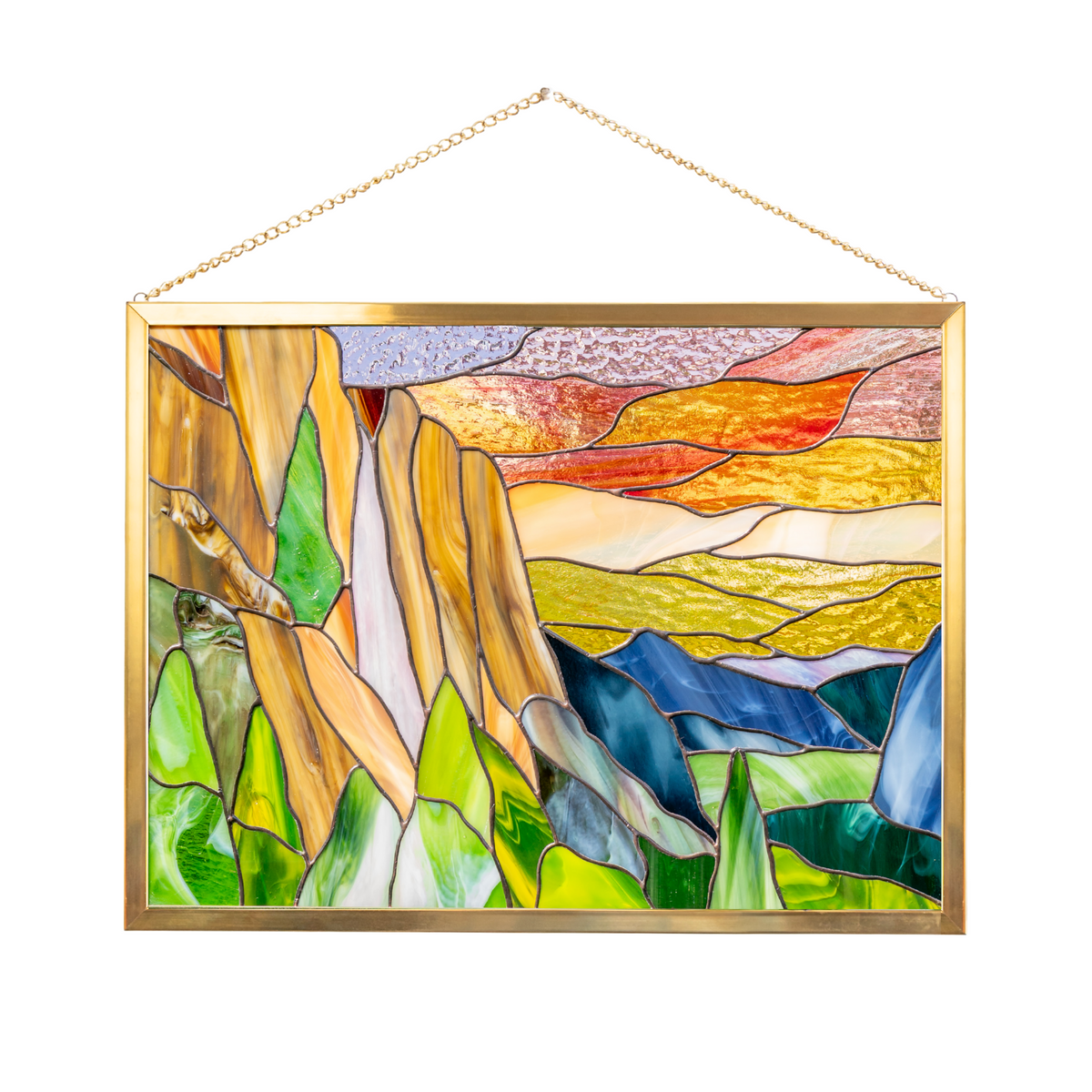 Stained glass panel showing white waterfall and orange sunset — Yosemite-inspired handmade artwork.