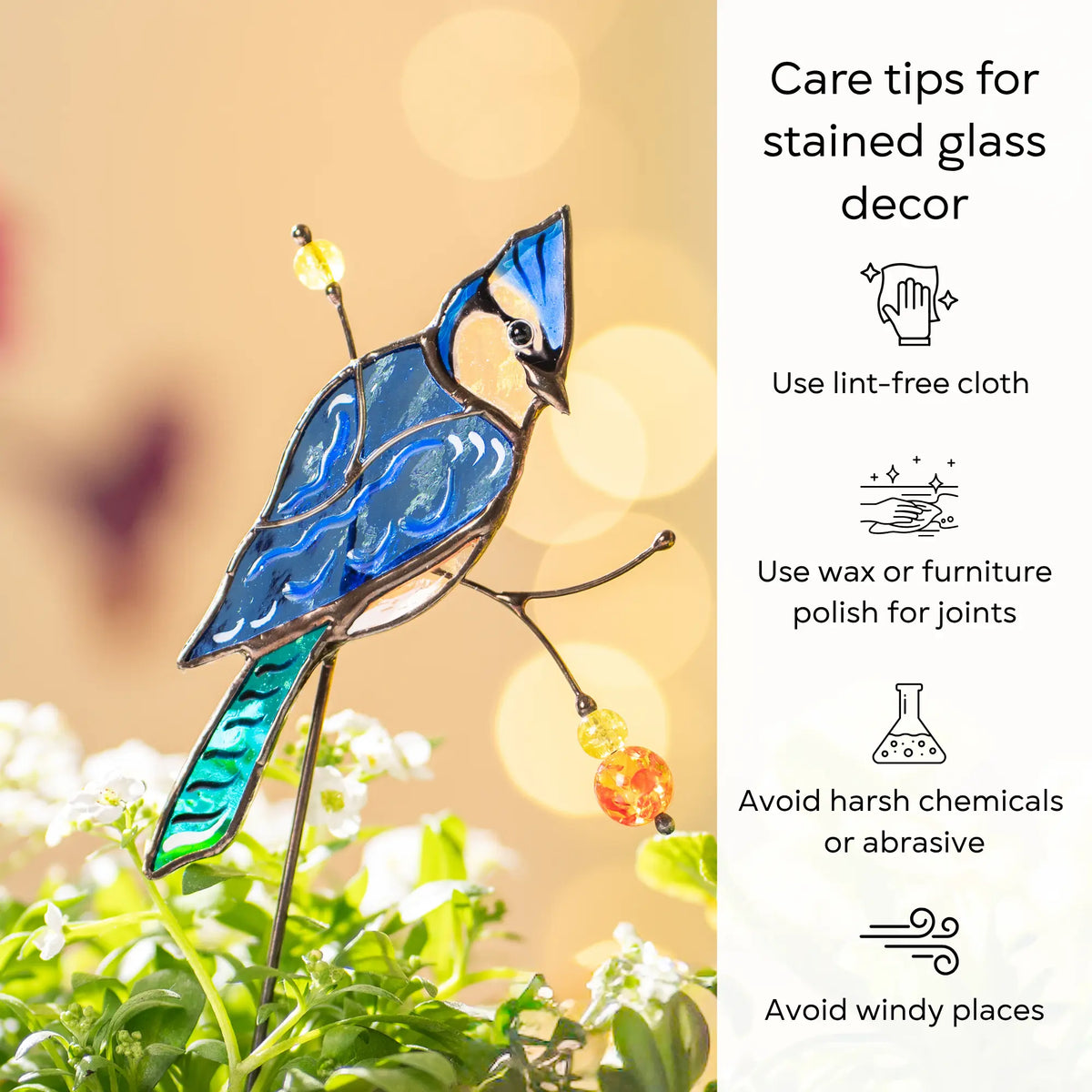 Stained glass blue jay plant stake with care tips on a blurred natural background: use lint-free cloth, polish joints with car wax or furniture polish, avoid harsh chemicals, and windy places.