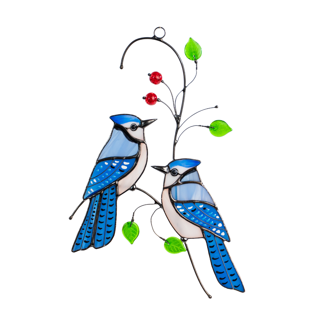 Two stained glass blue jays with red beads and green leaves on wire window hanging