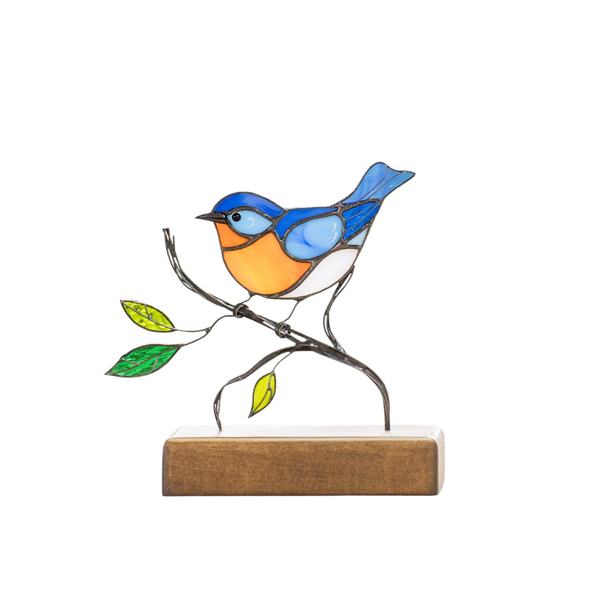 Stained glass bluebird with blue wings and orange belly standing on a natural wooden base