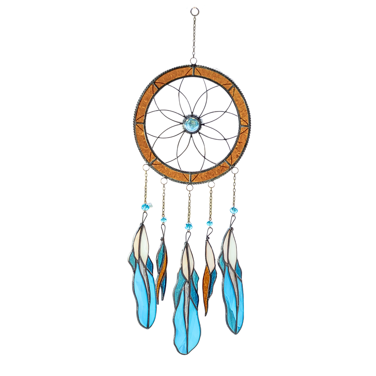 Stained glass dreamcatcher with amber ring, blue crystal center, and five hanging feathers in blue, amber, and cream tones.