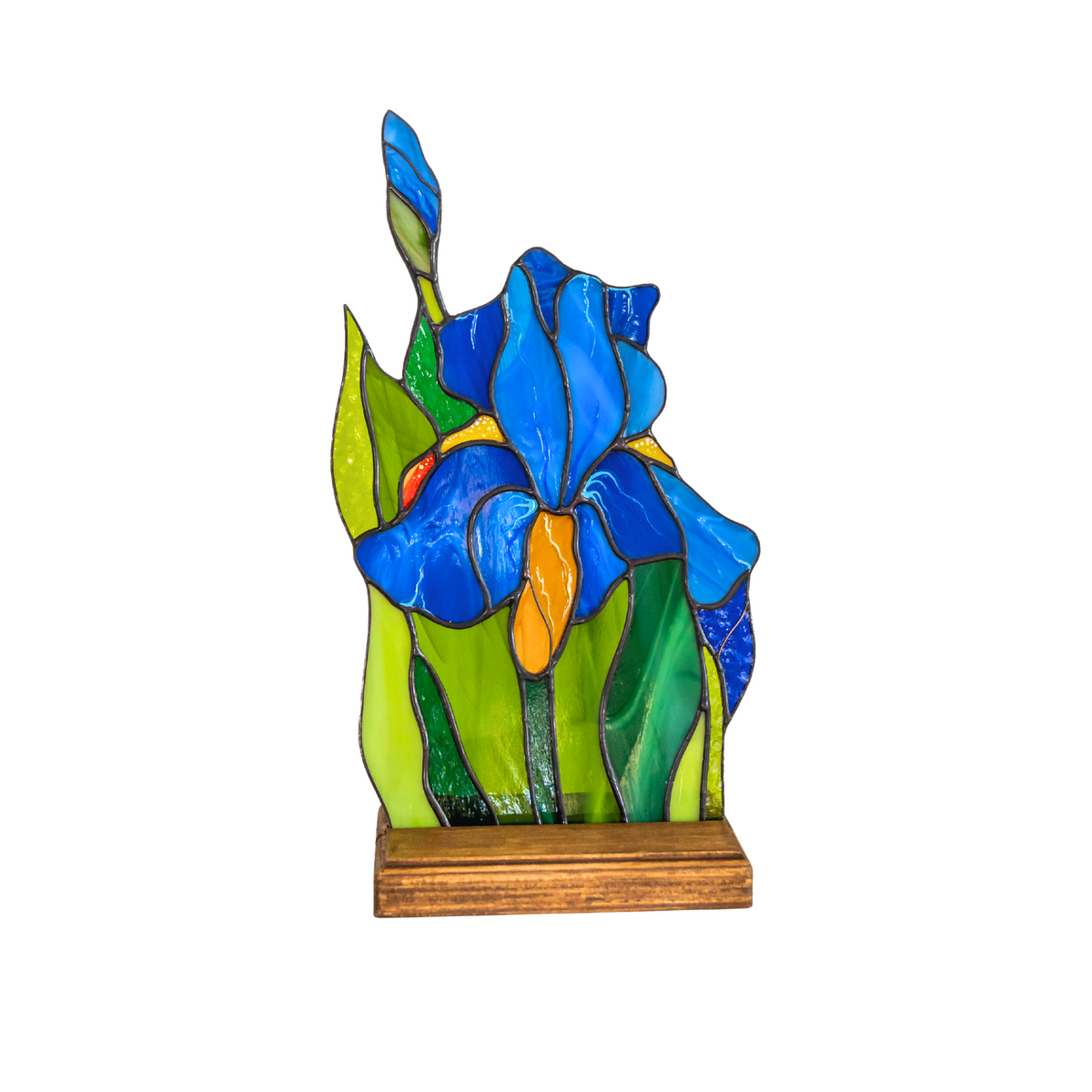 Colorful stained glass iris suncatcher on wooden base, isolated on white background.