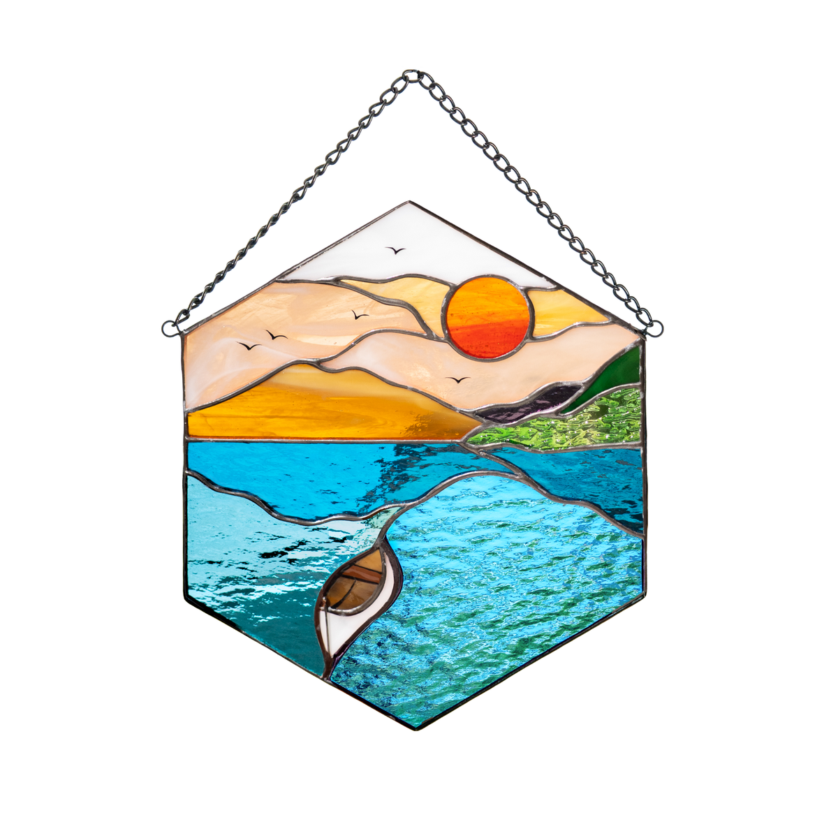 Stained glass panel featuring a boat on a sunset