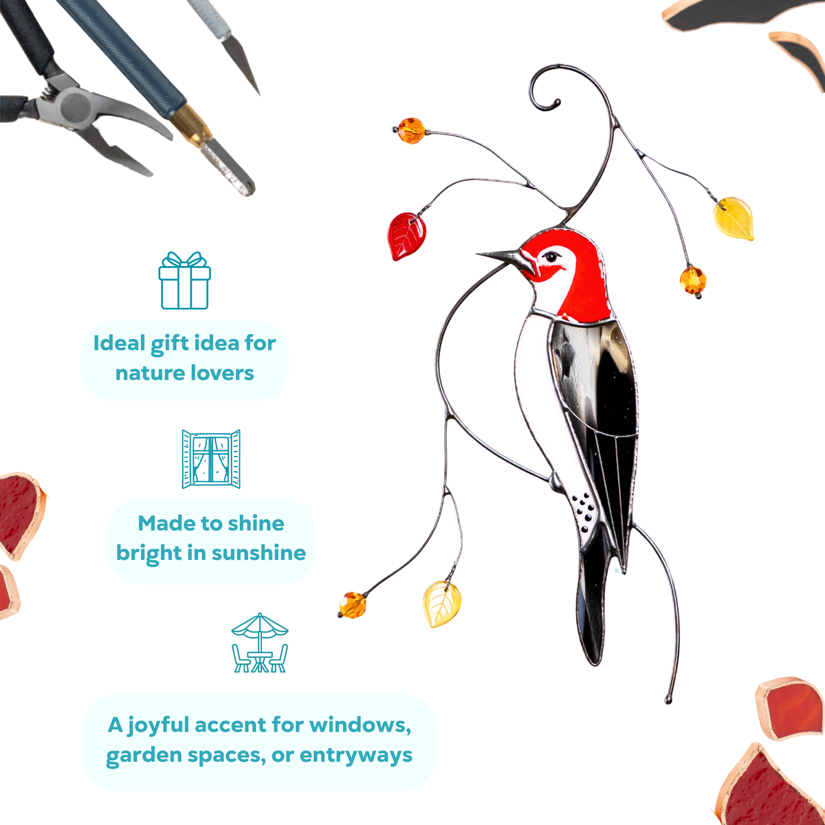 Stained glass woodpecker suncatcher with red head and yellow leaves, styled on a white background with tools.
