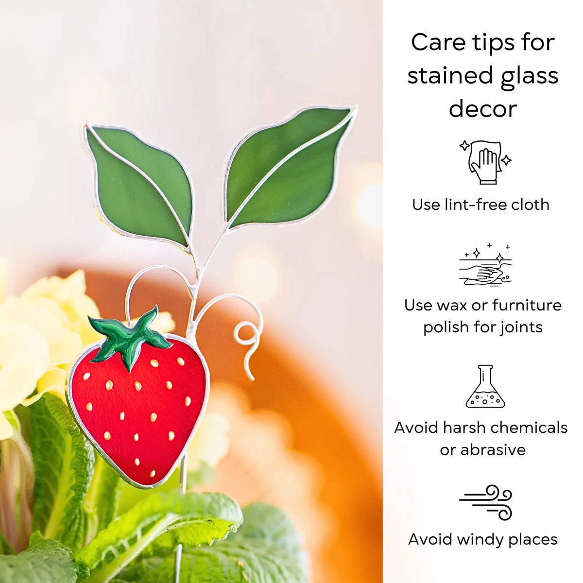 Strawberry stained glass plant stake with care tips on the right side: use lint-free cloth, polish joints with car wax or furniture polish, avoid harsh chemicals, and windy places.