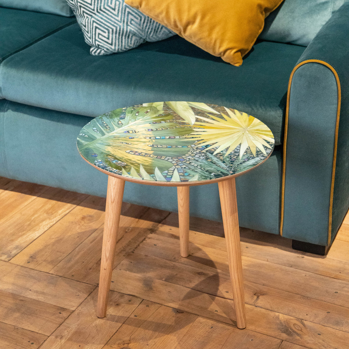 Stained glass mosaic coffee table depicting monstera leaves