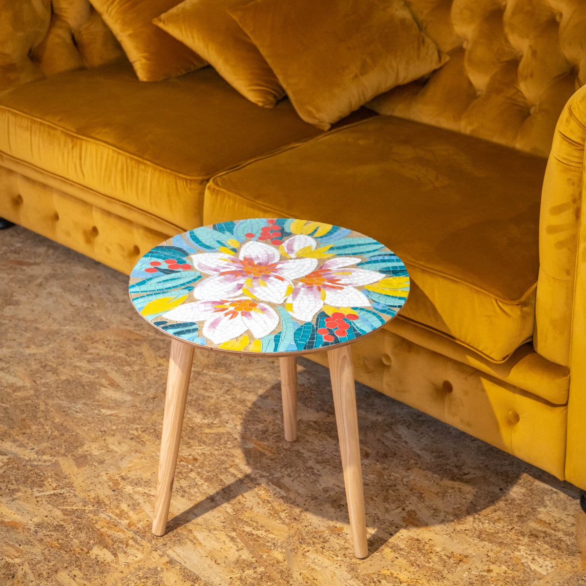 Stained glass round mosaic table depicting white and pink flowers