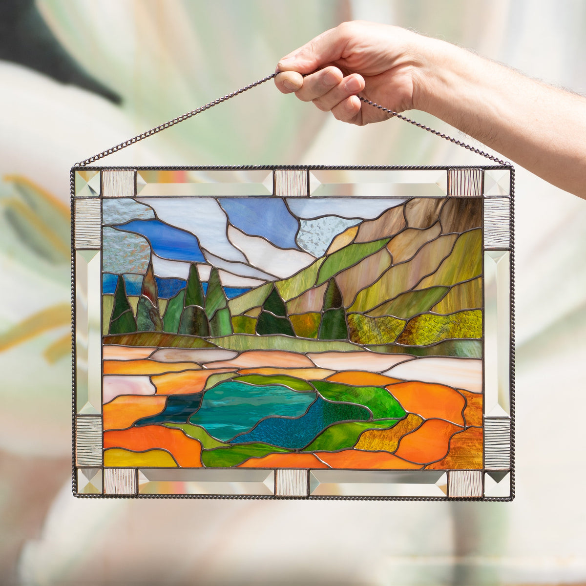 Stained glass window panel depicting Yellowstone national park