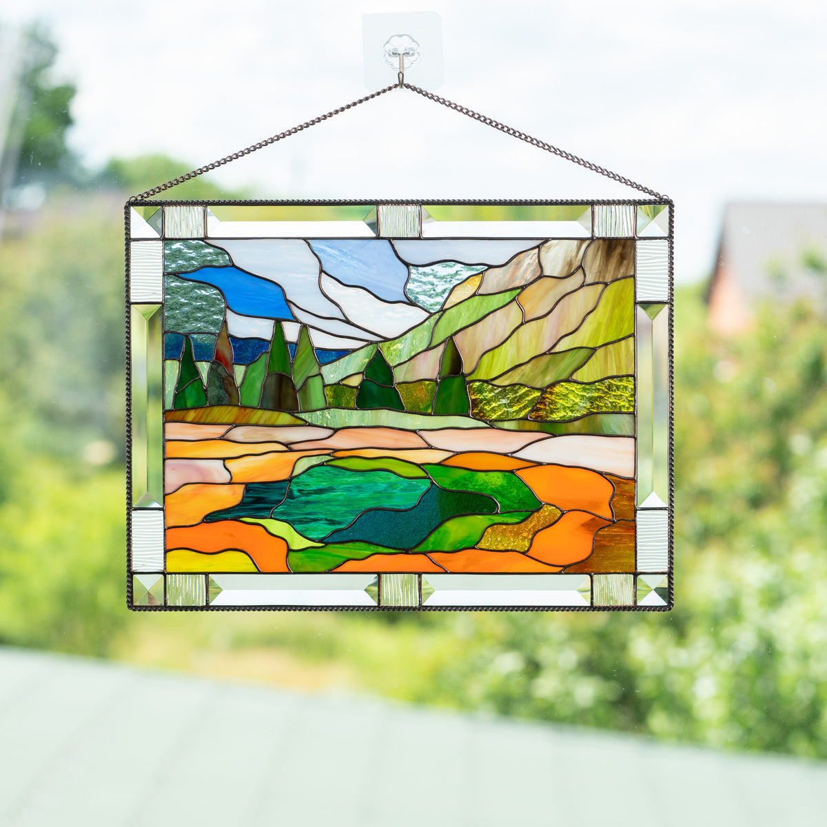 Stained glass window hanging of a Yellowstone national park