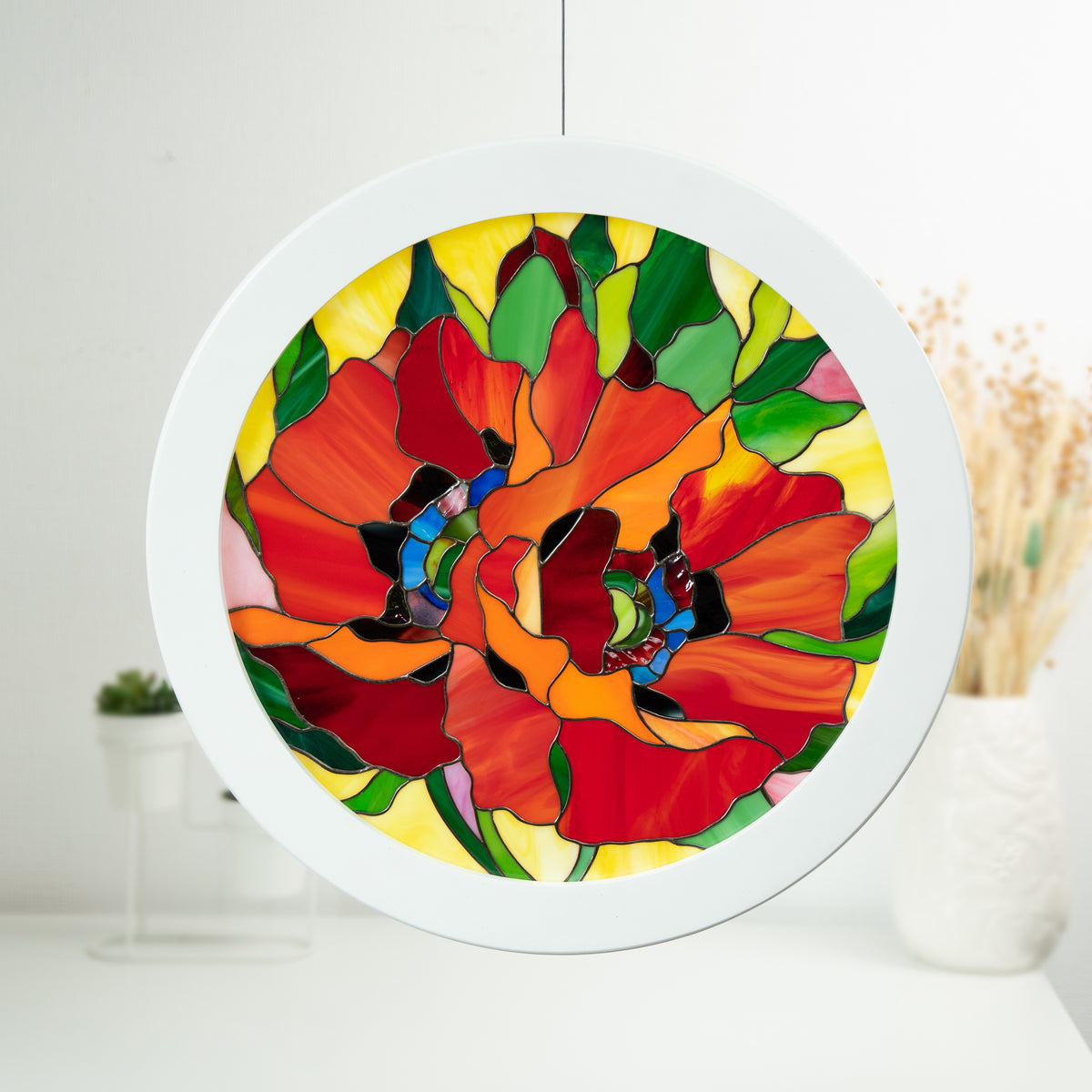 Stained glass round window panel depicting red poppies