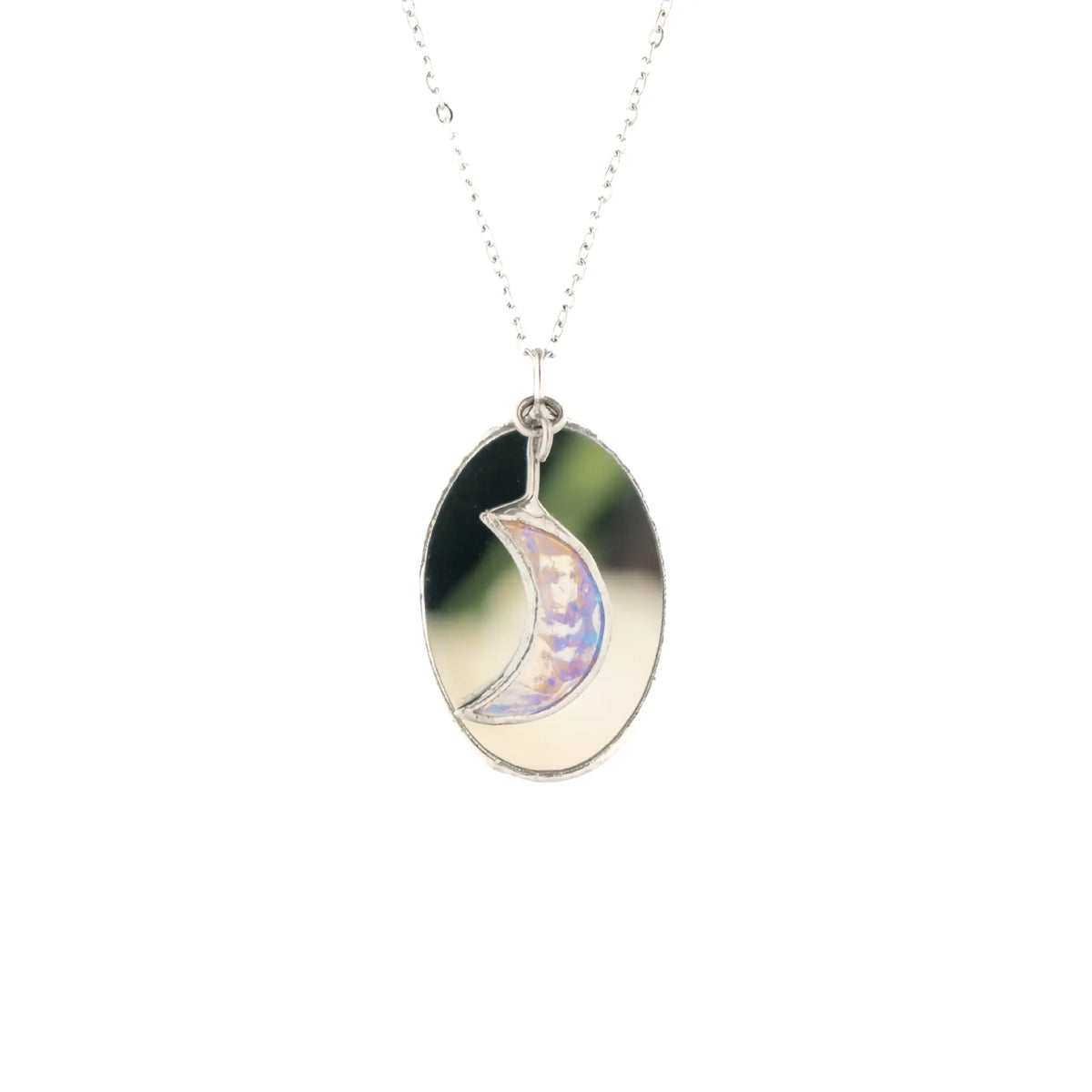 Handmade stained glass moon necklace with an iridescent crescent moon set over an oval mirror pendant on a stainless steel chain - a celestial gift for her from Glass Art Stories
