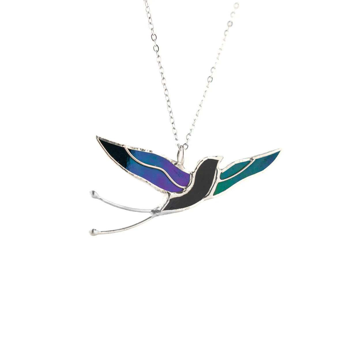 Handmade stained glass swallow necklace - a graceful bird in flight cut from shimmering iridescent glass, on a fine stainless steel chain, a bird lover gift from Glass Art Stories