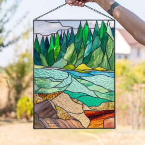 Stained glass hanging with a nature landscape 