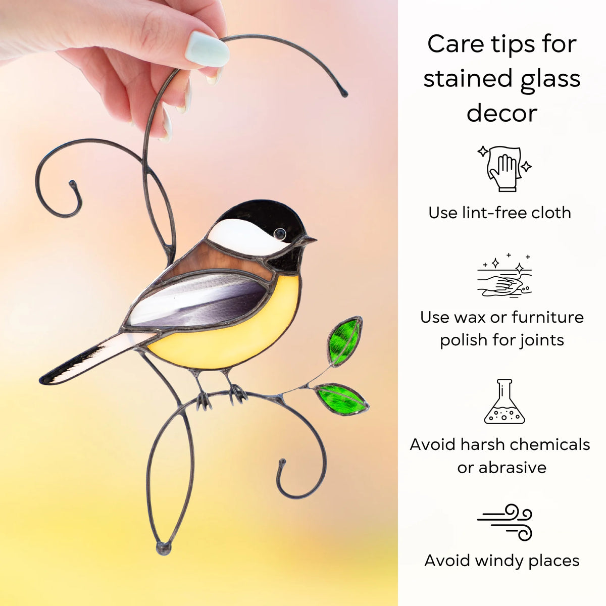 Care tips for a stained glass chickadee suncatcher held in hand - dust with a lint-free cloth, protect the joints with wax or furniture polish, and avoid harsh chemicals, abrasives and windy places