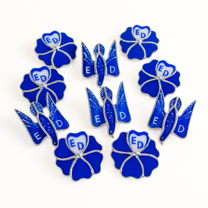 A set of stained glass pins in the shape of blue flowers
