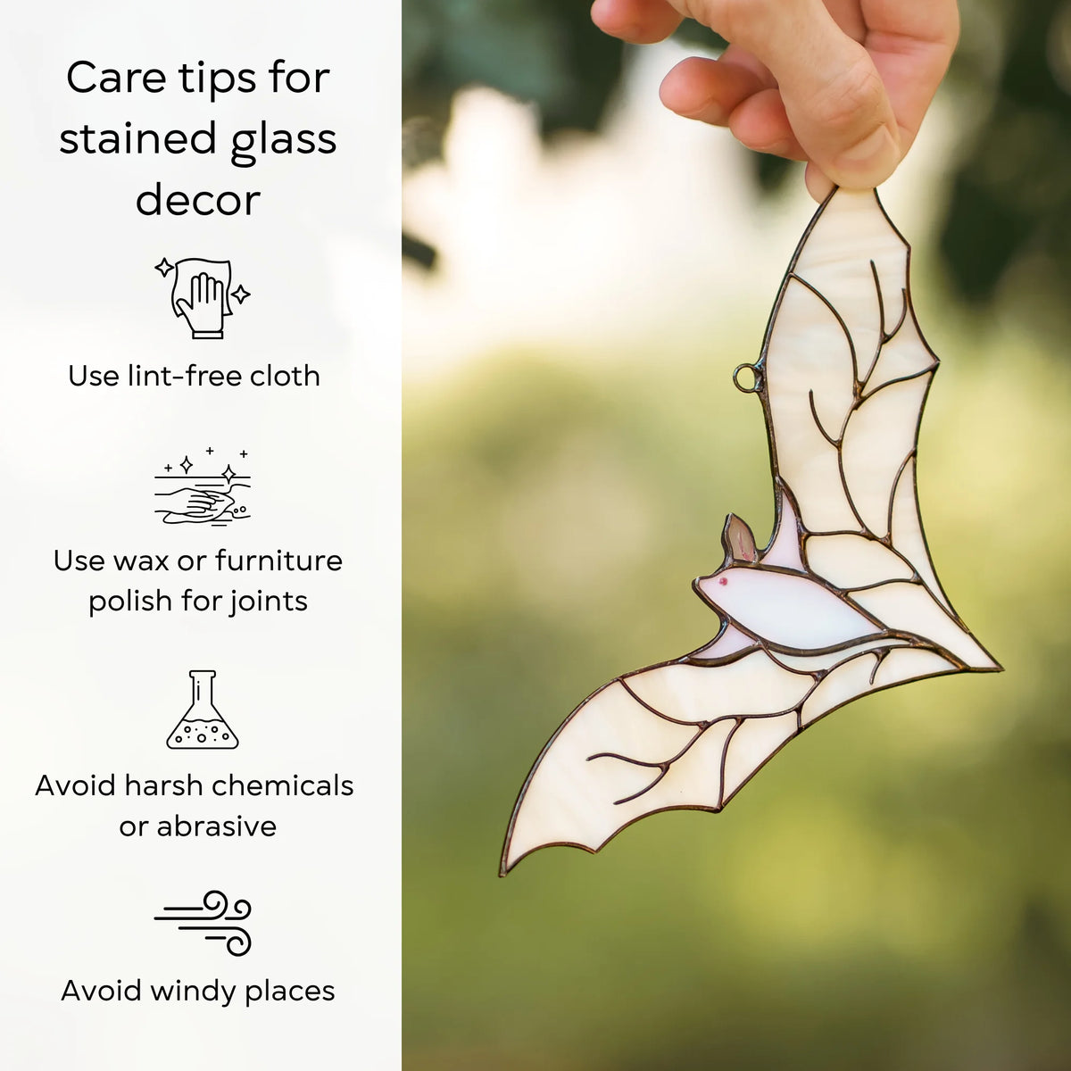Care tips graphic for stained glass decor beside a hand holding the white stained glass bat suncatcher outdoors in golden light.