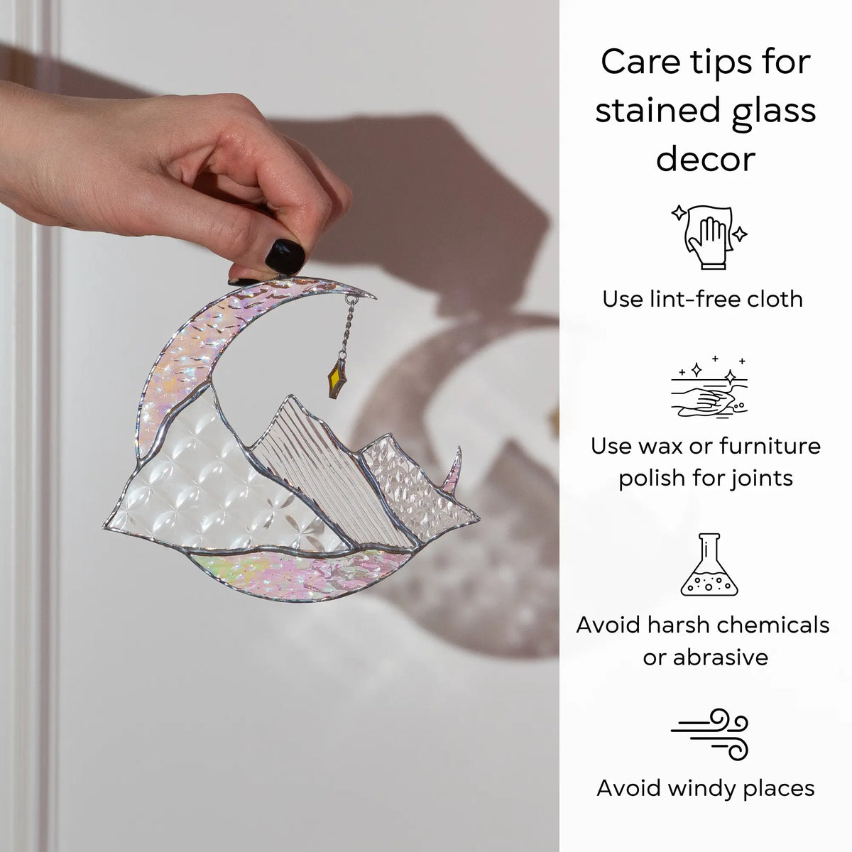 Care tips for stained glass decor with a hand holding a piece of stained glass art: use lint-free cloth, polish joints with car wax or furniture polish, avoid harsh chemicals, and windy places.