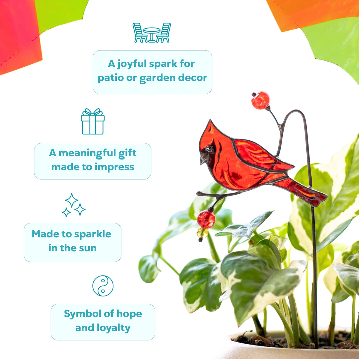 Stained glass garden stake featuring cardinal on a branch