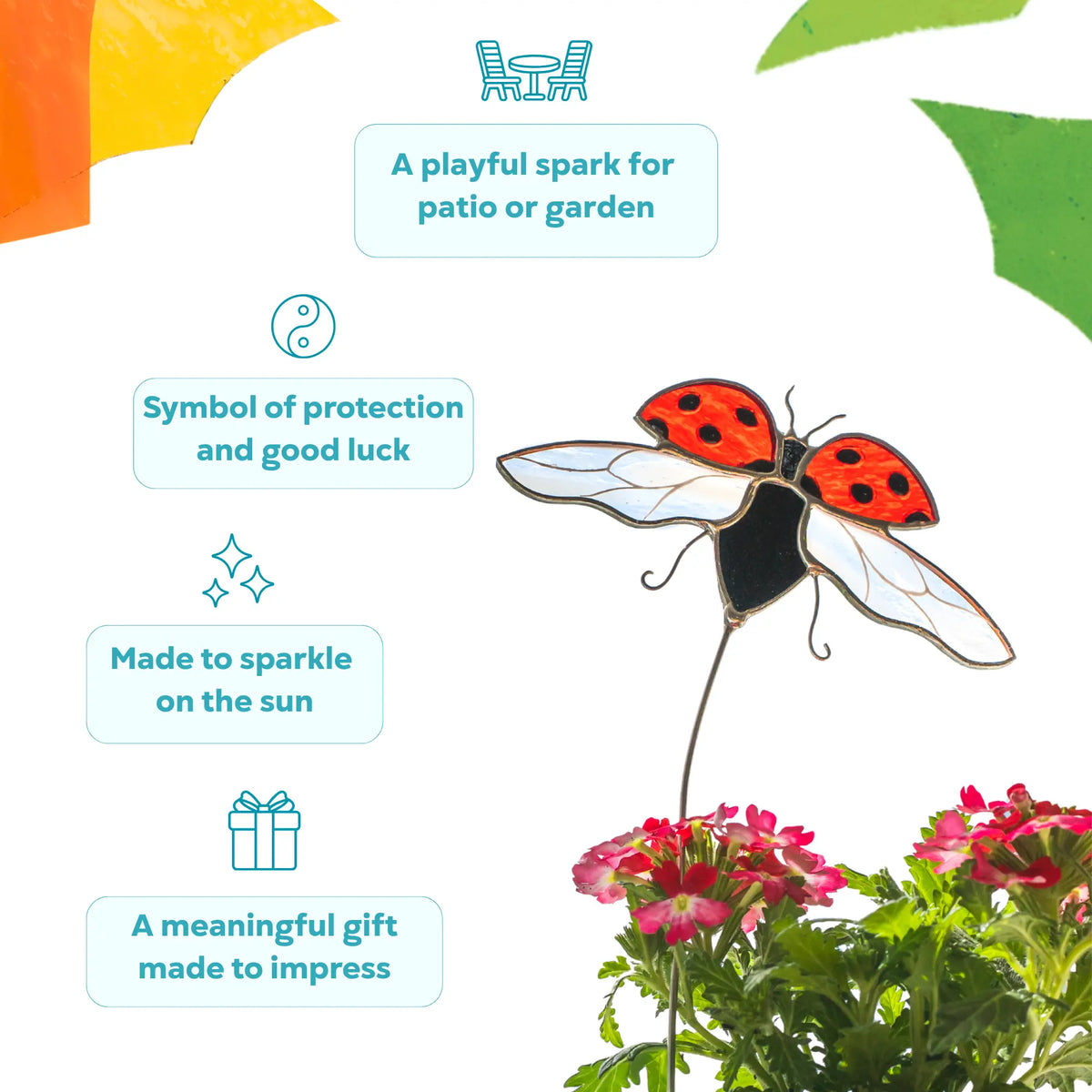 Stained glass ladybug plant stake as a symbol of good luck