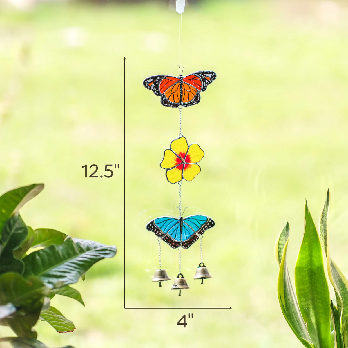 Decorative stained glass wind chime with butterflies and flowers on a green background with dimensions: 12.5 x 4 inches