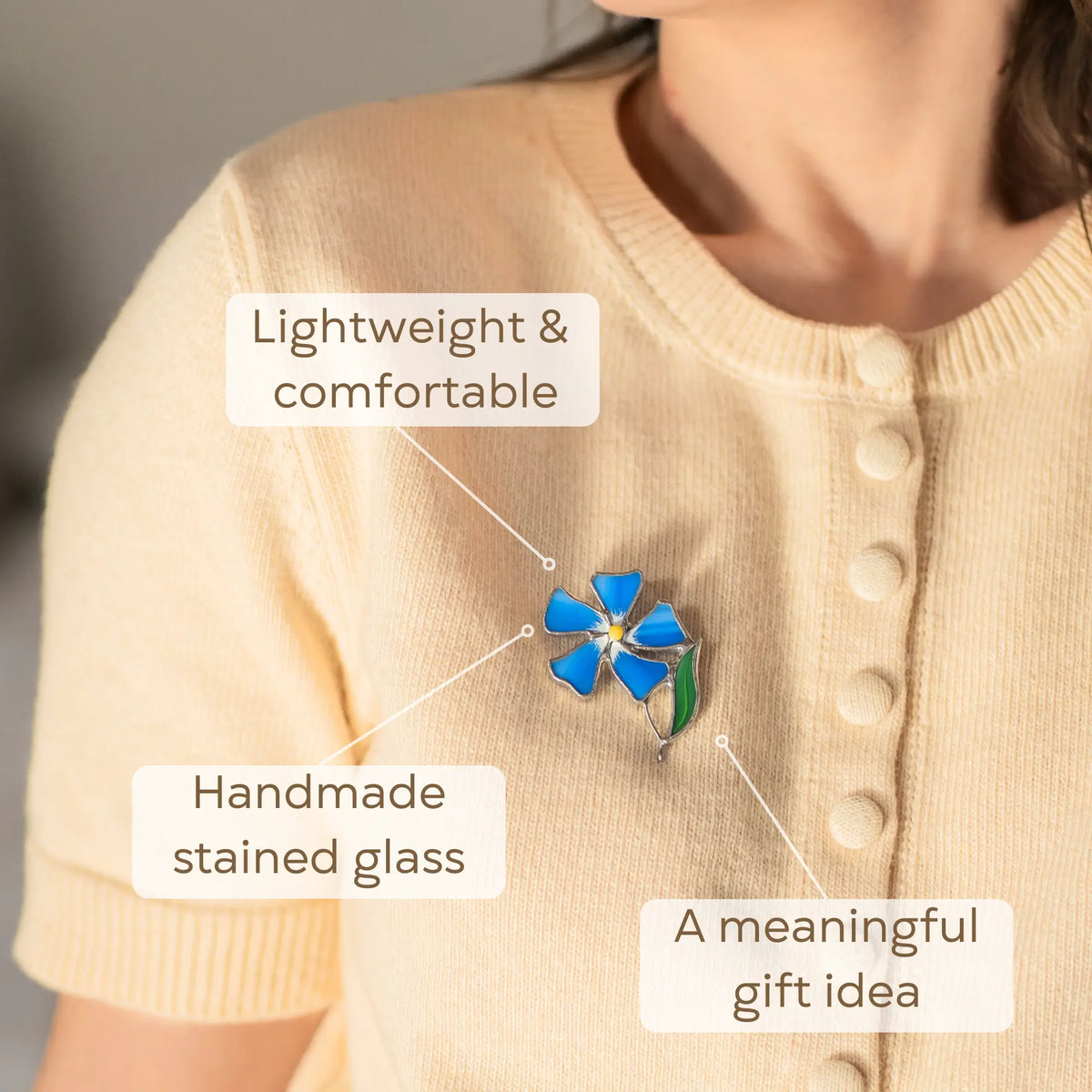 Women wearing a blue periwinkle flower brooch, choose it as a meaningful gift for loved one