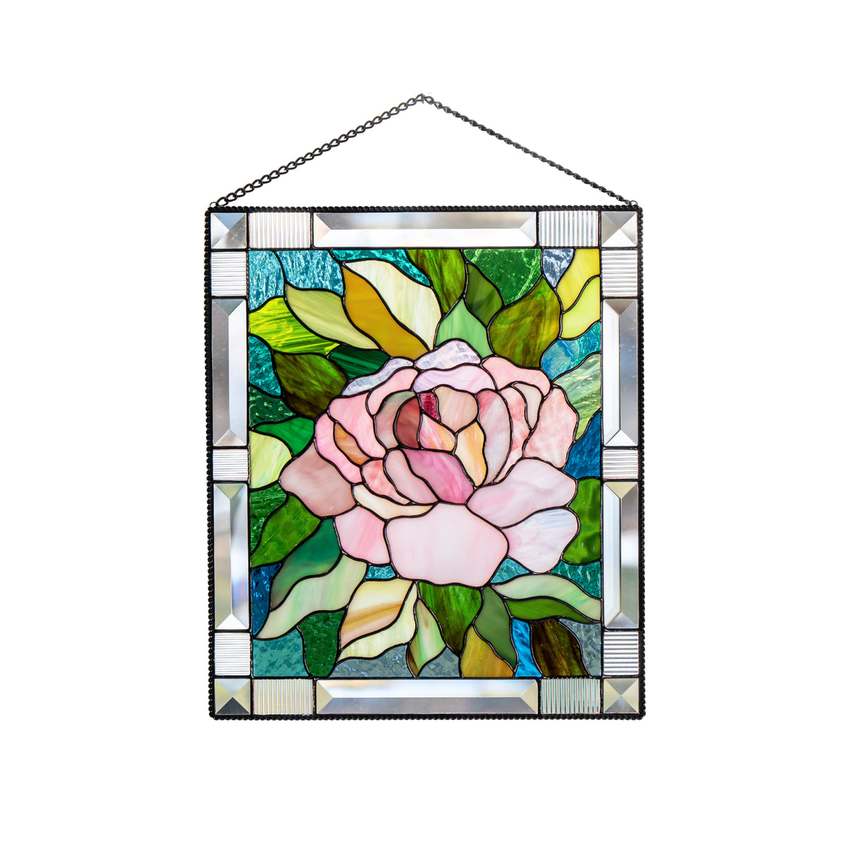 Stained glass panel with a pink peony design on a white background