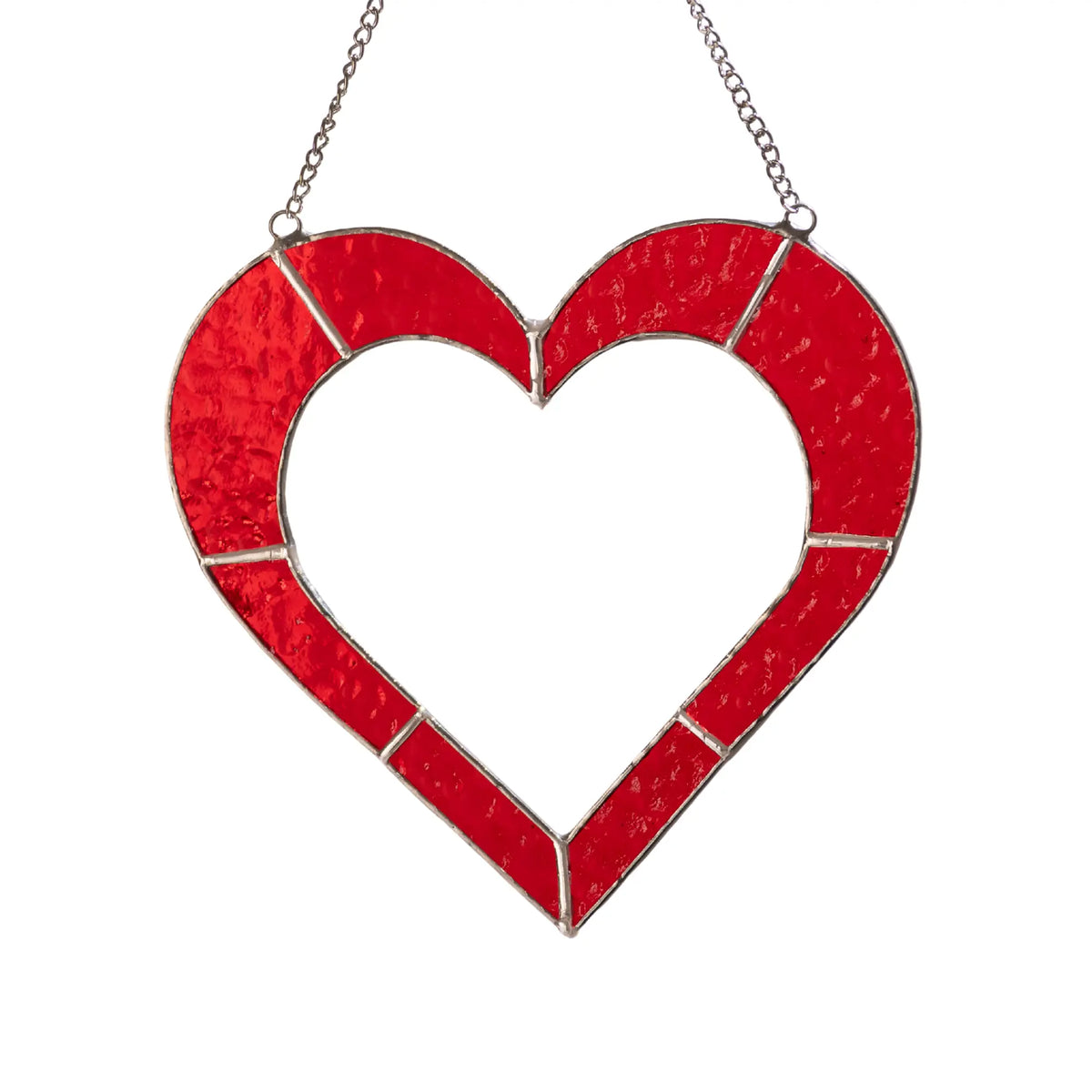 Handmade red heart stained glass suncatcher with textured red glass and silver solder lines.