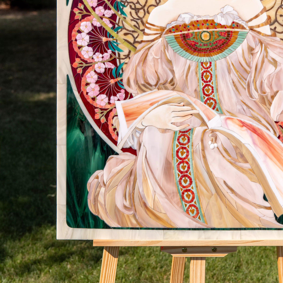 Close-up of the Riviera mosaic highlighting flowing dress folds, soft pastel glass tones, and intricate decorative patterns.
