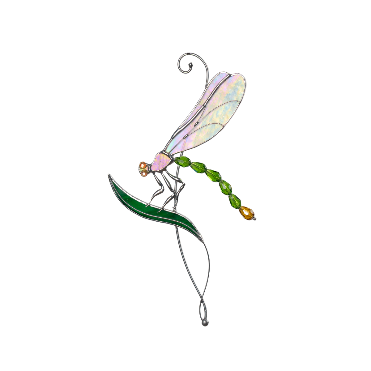 Green stained glass dragonfly with shimmering wings perched on a curved glass leaf against white background.
