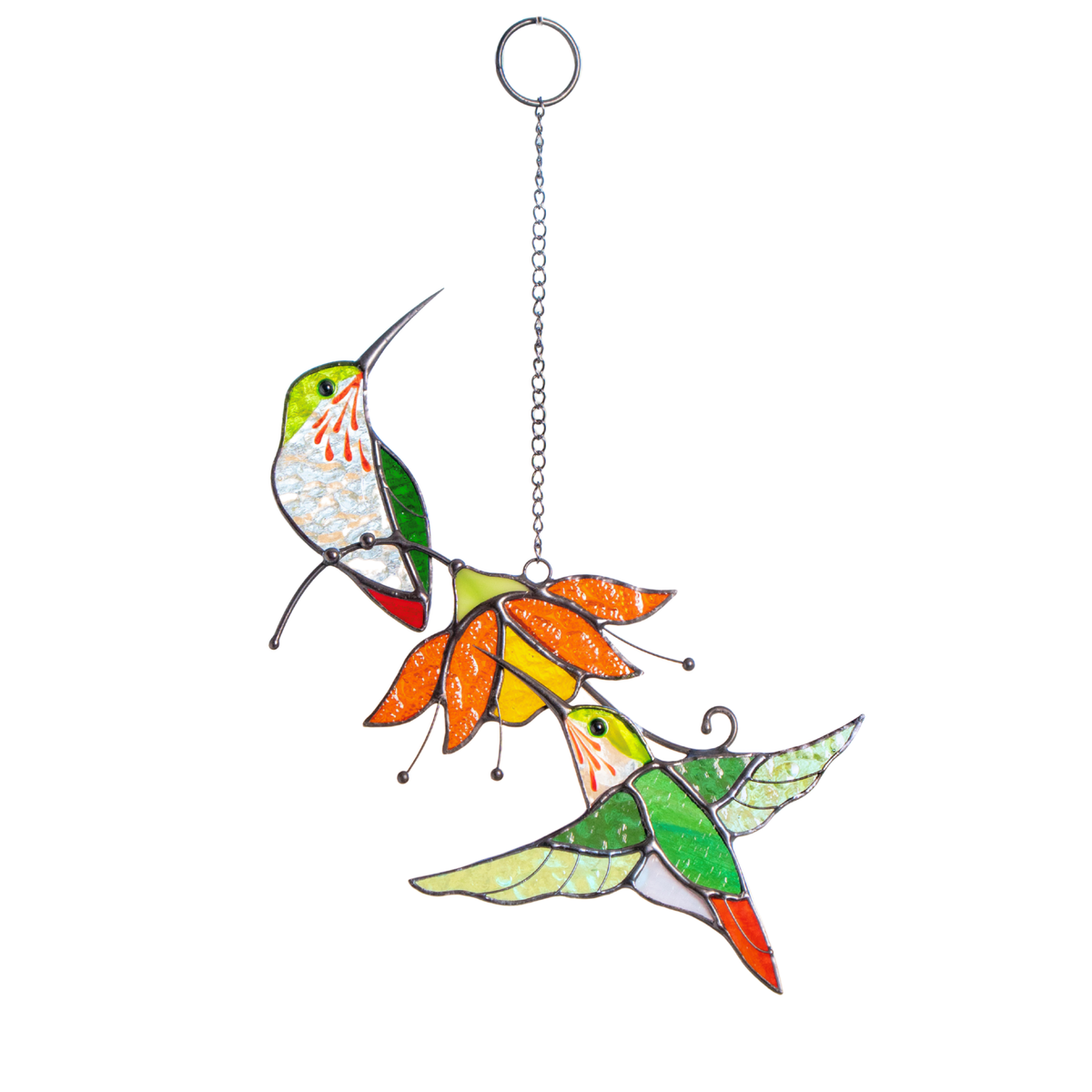 Two stained glass hummingbirds with green and red wings perched on a bright orange flower, hanging by a chain.