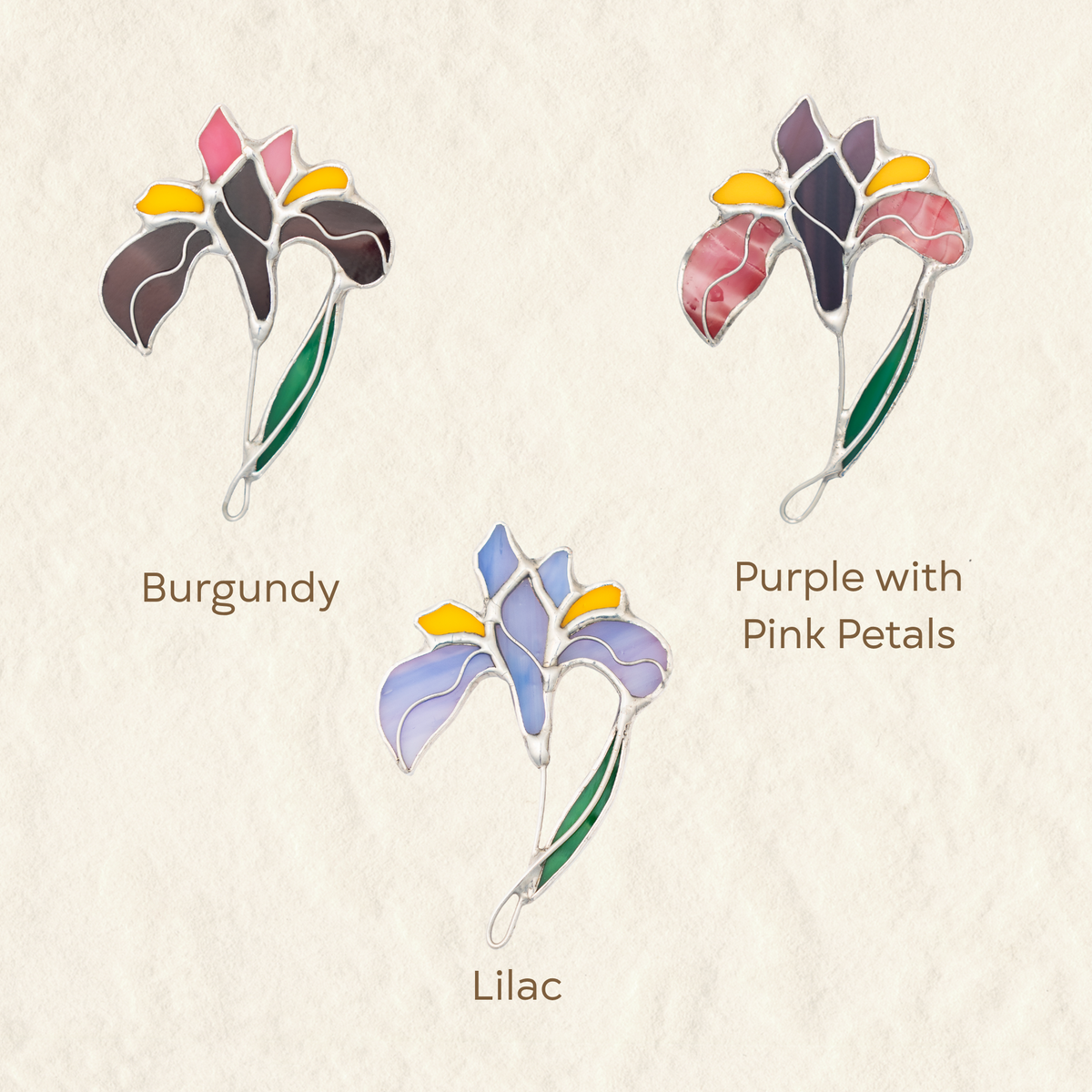 Three floral stained glass iris brooches in lilac, burgundy and purple colors
