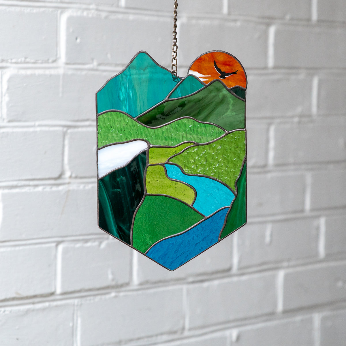 Stained glass panel of a landscape for window decor