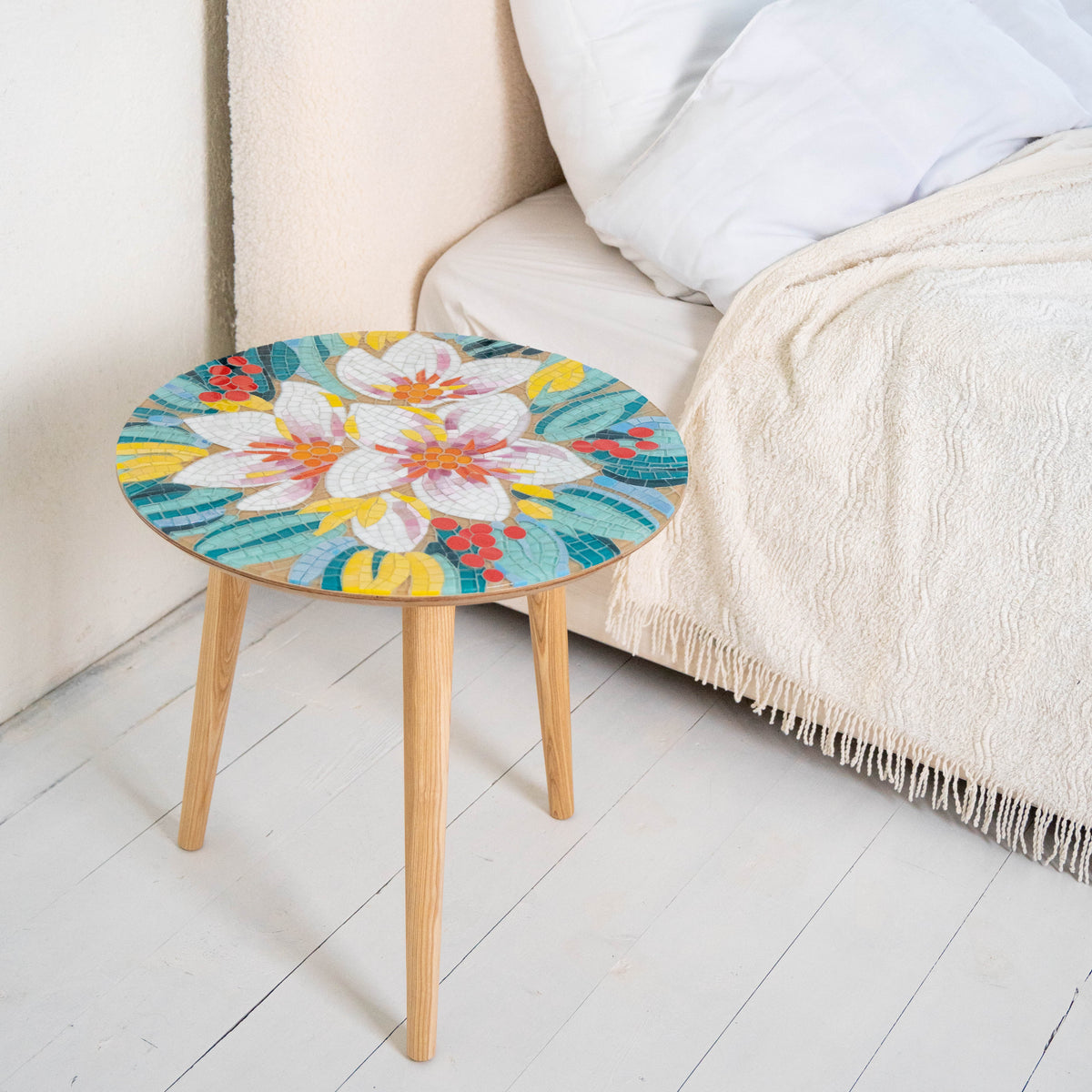 Stained glass mosaic coffee table depicting white and pink flowers