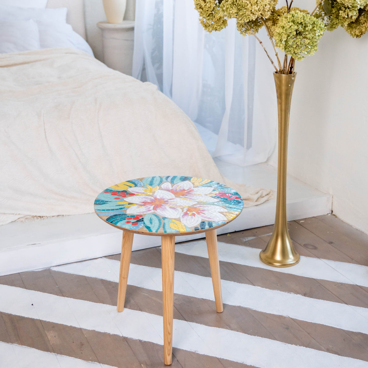 Stained glass round coffee table of stained glass mosaic depicting white and pink flowers