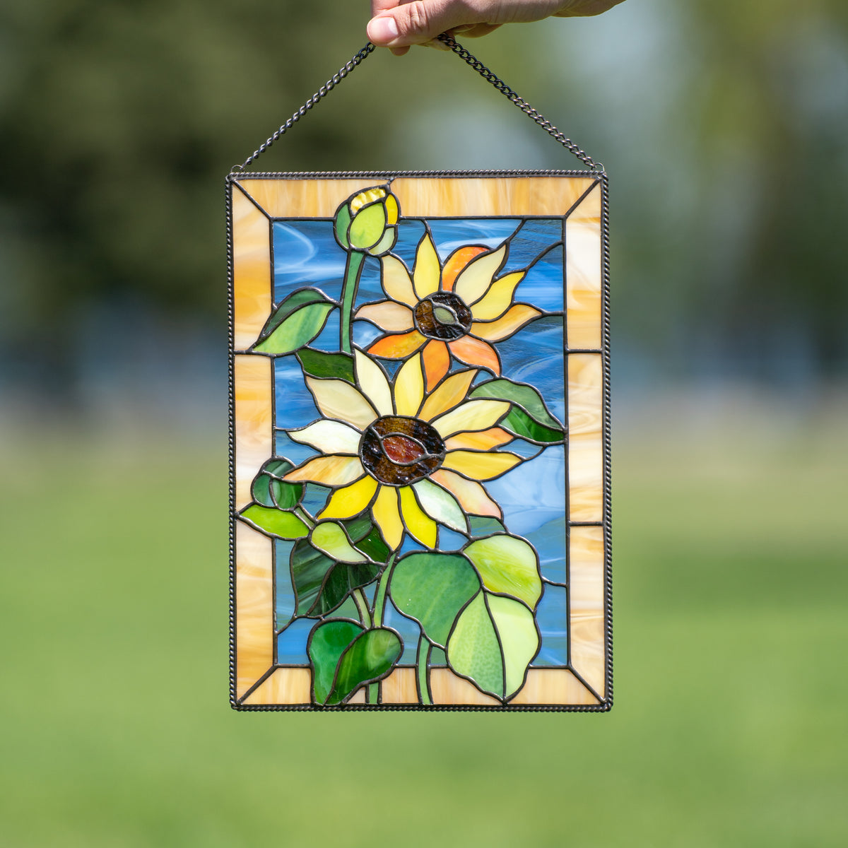 Stained glass window hanging of Ukrainian colouring depicting sunflowers