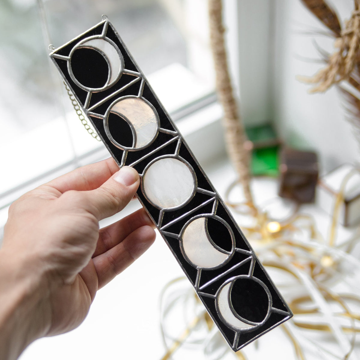 Moon phases vertical panel of stained glass